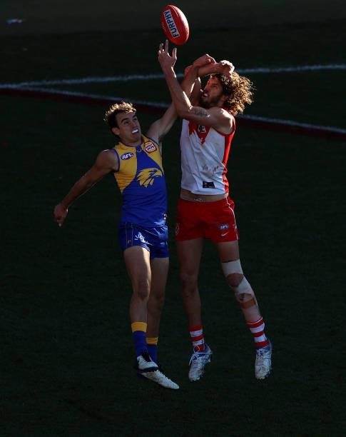 Luke Edwards of the Eagles and Tom Hickey of the Swans compete for the ball during the round 16 AFL match between Sydney Swans and West Coast Eagles...
