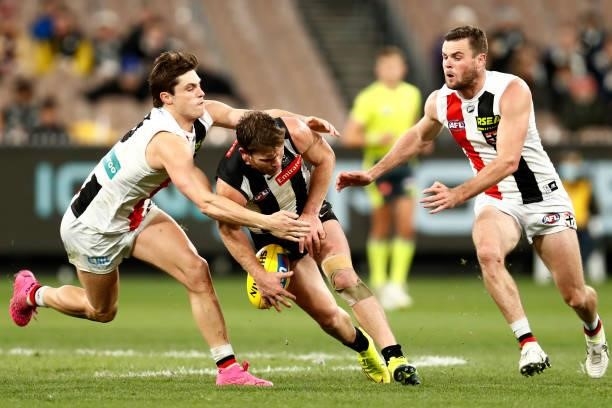 Jack Steele of the Saints tackles Taylor Adams of the Magpies during the round 16 AFL match between Collingwood Magpies and St Kilda Saints at...