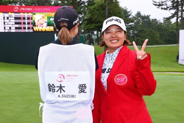 Ai Suzuki of Japan poses with her caddie after winning the tournament following the final round of the Shiseido Ladies Open at Totsuka Country Club...