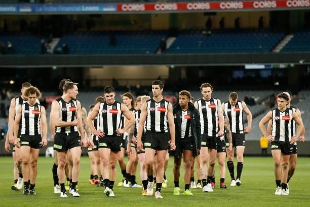 Dejected Collingwood players walk off the ground after the round 16 AFL match between Collingwood Magpies and St Kilda Saints at Melbourne Cricket...