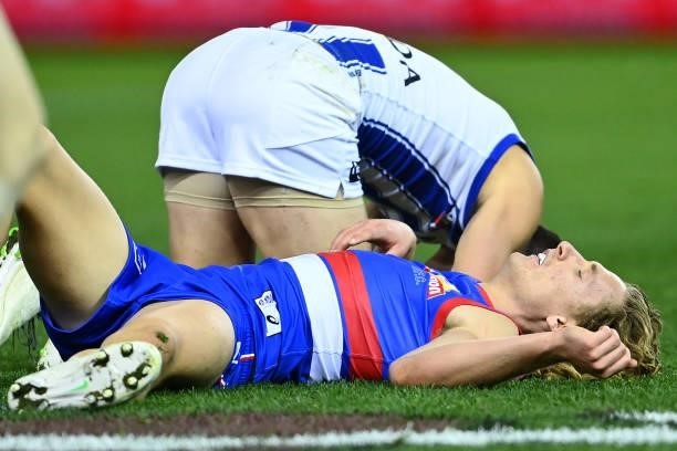 Aaron Naughton of the Bulldogs lays on the ground concussed during the round 16 AFL match between Western Bulldogs and North Melbourne Kangaroos at...