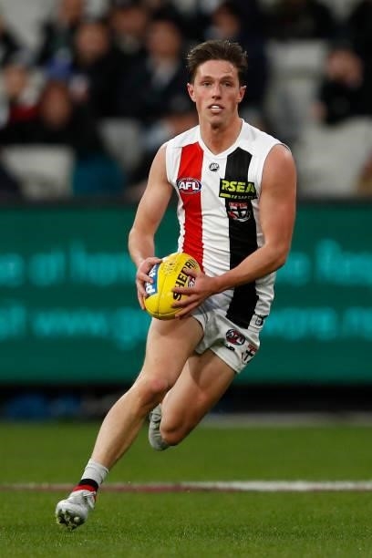 Leo Connolly of the Saints runs with the ball during the round 16 AFL match between Collingwood Magpies and St Kilda Saints at Melbourne Cricket...