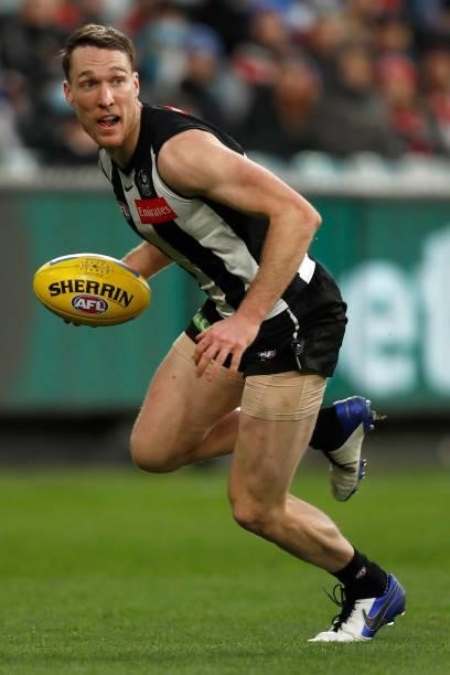 Jack Madgen of the Magpies runs with the ball during the round 16 AFL match between Collingwood Magpies and St Kilda Saints at Melbourne Cricket...