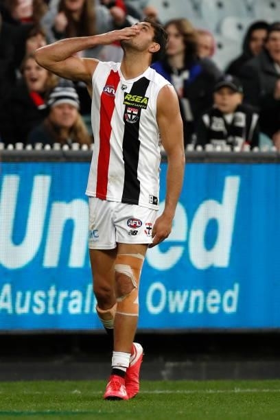 Paddy Ryder of the Saints pays tribute to his uncle after kicking a goal during the round 16 AFL match between Collingwood Magpies and St Kilda...
