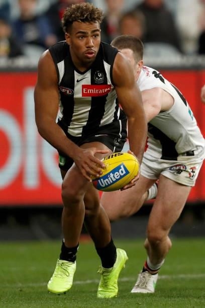 Issac Quaynor of the Magpies runs with the ball during the round 16 AFL match between Collingwood Magpies and St Kilda Saints at Melbourne Cricket...