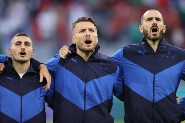 Marco Verratti, Ciro Immobile and Leonardo Bonucci of Italy sing their mational anthem prior the UEFA Euro 2020 Championship Quarter-final match...