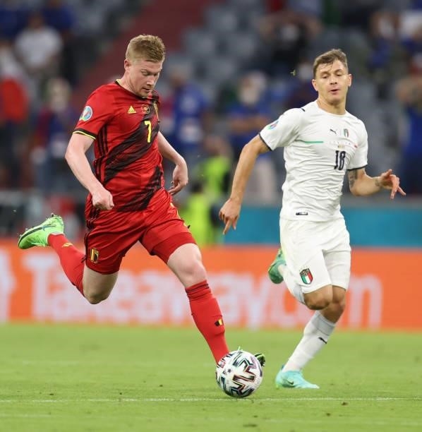 Kevin de Bruyne of Belgium is challenged by Nicolo Barella of Italy during the UEFA Euro 2020 Championship Quarter-final match between Belgium and...