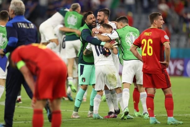 Players of Italy celebrate after the UEFA Euro 2020 Championship Quarter-final match between Belgium and Italy at Football Arena Munich on July 02,...