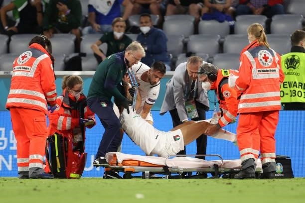 Leonardo Spinazzola of Italy is carried off on a stretcher during the UEFA Euro 2020 Championship Quarter-final match between Belgium and Italy at...