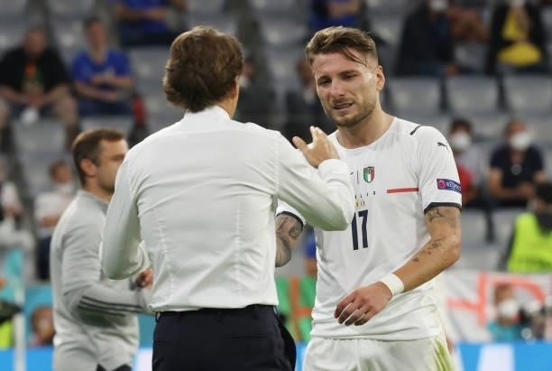 Roberto Mancini, Head Coach of Italy, shakes hands with Ciro Immobile after his substitution during the UEFA Euro 2020 Championship Quarter-final...