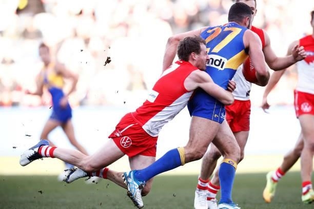 Jack Darling of the Eagles is tackled by Harry Cunningham of the Swans during the round 16 AFL match between Sydney Swans and West Coast Eagles at...