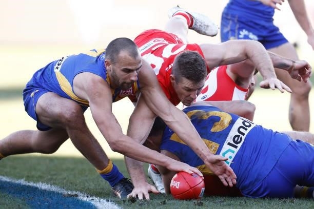 Luke Parker of the Swans and Dom Sheed of the Eagles contest the ball during the round 16 AFL match between Sydney Swans and West Coast Eagles at...