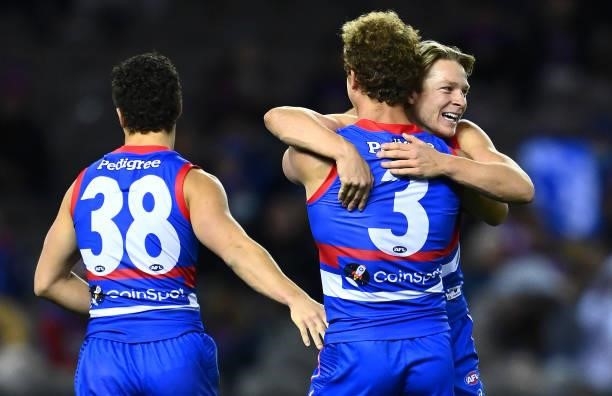 Mitch Wallis and Cody Weightman of the Bulldogs celebrate a goal during the round 16 AFL match between Western Bulldogs and North Melbourne Kangaroos...