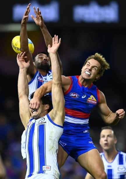 Mitch Wallis of the Bulldogs spoils a mark by Robbie Tarrant of the Kangaroos during the round 16 AFL match between Western Bulldogs and North...