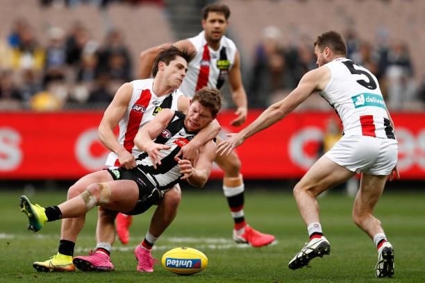 Jack Steele of the Saints tackles Taylor Adams of the Magpies during the round 16 AFL match between Collingwood Magpies and St Kilda Saints at...