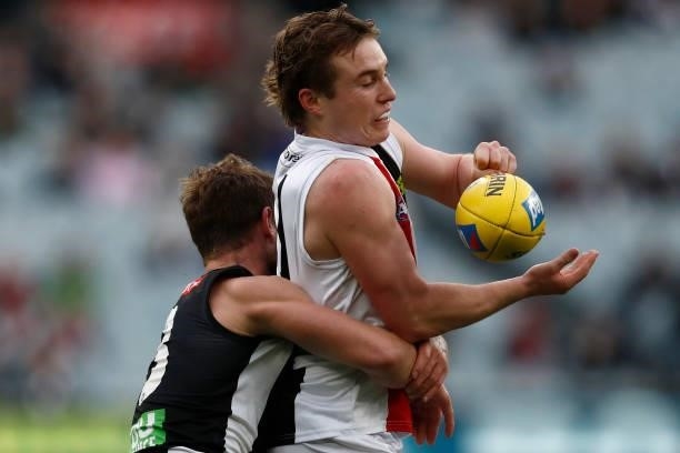 Ryan Byrnes of the Saints is tackled during the round 16 AFL match between Collingwood Magpies and St Kilda Saints at Melbourne Cricket Ground on...