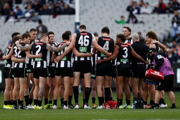 Collingwood players huddle before the round 16 AFL match between Collingwood Magpies and St Kilda Saints at Melbourne Cricket Ground on July 04, 2021...