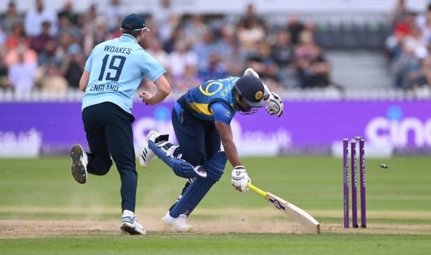 Sri Lanka batsman Chamika Karunaratne surves a run out attempt by England fielder Chris Woakes during the 3rd Royal London One Day International...