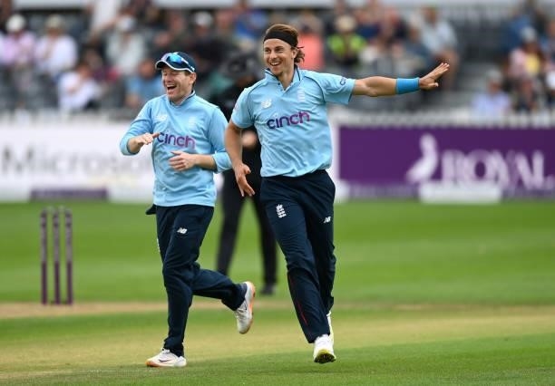Tom Curran of England celebrates with captain Eoin Morgan after dismissing Chamika Karunaratne of Sri Lanka during the third One Day International...