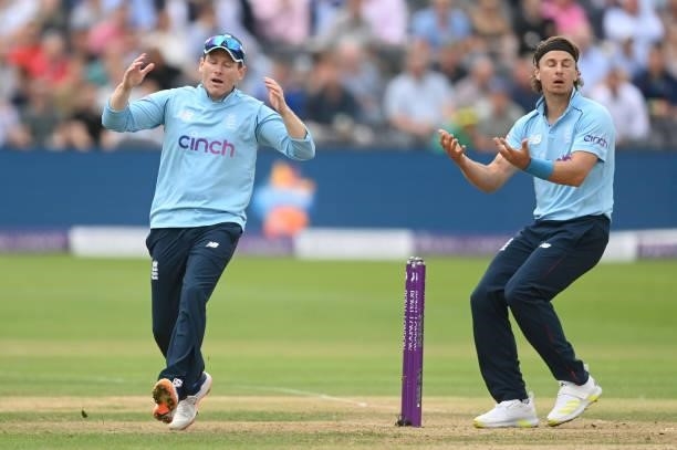 Eoin Morgan and Tom Curran of England reacts as a run out is missed during the third One Day International between England and Sri Lanka at Bristol...