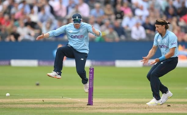 Eoin Morgan and Tom Curran of England reacts as a run out is missed during the third One Day International between England and Sri Lanka at Bristol...