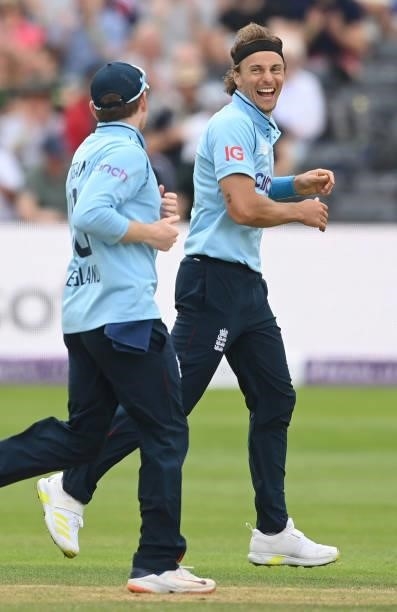 Tom Curran of England celebrates with Eoin Morgan after dismissing Chamika Karunaratne of Sri Lanka during the third One Day International between...
