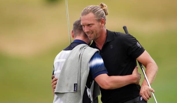 Marcel Siem of Germany hugs with his buddy volunteer during Day Four of the Kaskada Golf Challenge at Kaskada Golf Resort on July 04, 2021 in Brno,...