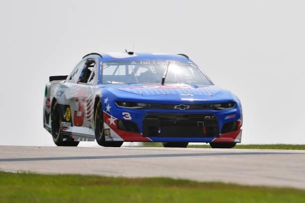 Austin Dillon, driver of the Dow Military Degree Equivalency Chevrolet, drives during qualifying for the NASCAR Cup Series Jockey Made in America 250...