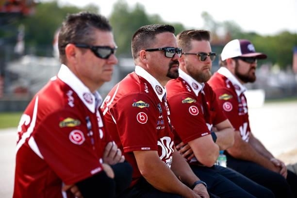Crew members of the Dr. Pepper Toyota, driven by Bubba Wallace wait on the grid during qualifying for the NASCAR Cup Series Jockey Made in America...