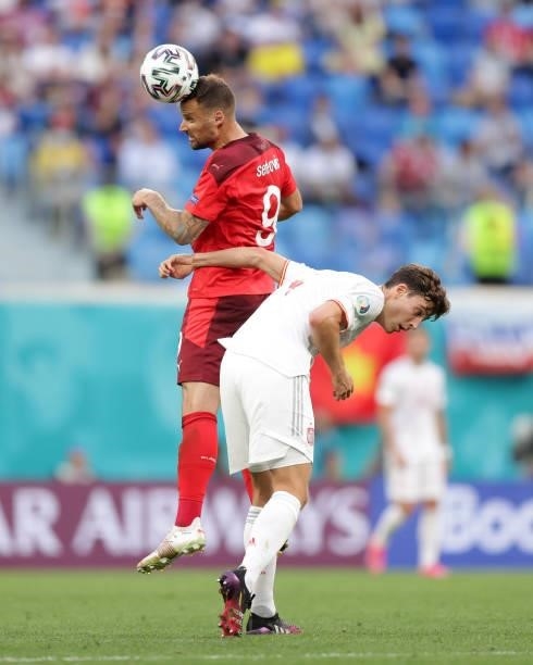 Haris Seferovic of Switzerland wins the header before Pau Torres of Spain during the UEFA Euro 2020 Championship Quarter-final match between...