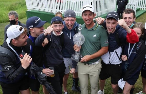 Lucas Herbert of Australia holds the winners trophy with local fans after the final round of The Dubai Duty Free Irish Open at Mount Juliet Golf Club...