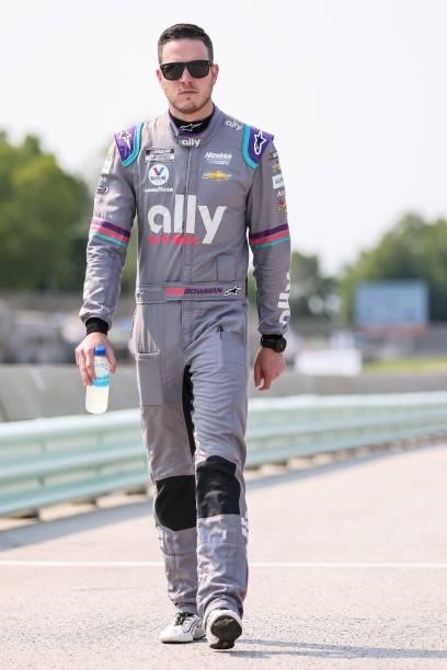 Alex Bowman, driver of the Ally Chevrolet, walks the grid during qualifying for the NASCAR Cup Series Jockey Made in America 250 Presented by Kwik...