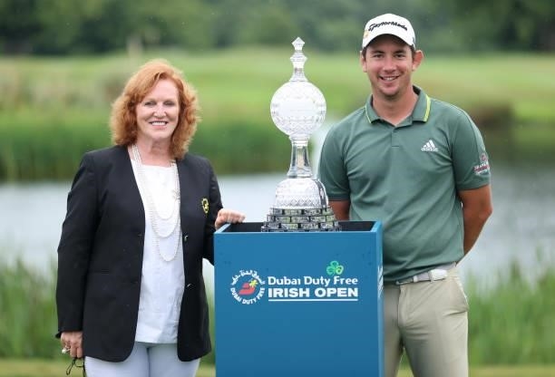 Lucas Herbert of Australia is presented with the winners trophy by Sinead El Sibai, Dubai Duty Free Senior Vice President of Marketing after the...