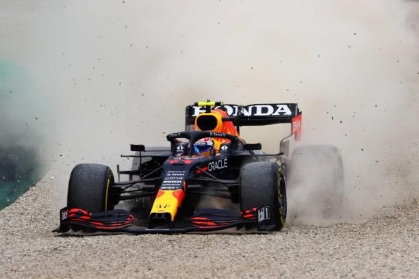Sergio Perez of Mexico driving the Red Bull Racing RB16B Honda runs wide during the F1 Grand Prix of Austria at Red Bull Ring on July 04, 2021 in...