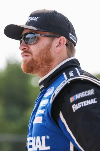 Chris Buescher, driver of the Fastenal Ford, walks the grid during qualifying for the NASCAR Cup Series Jockey Made in America 250 Presented by Kwik...