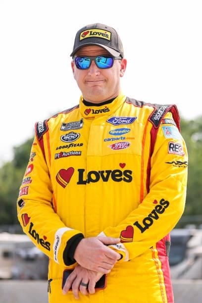 Michael McDowell, driver of the Love's Travel Stops Ford, poses for a photo on the grid during qualifying for the NASCAR Cup Series Jockey Made in...