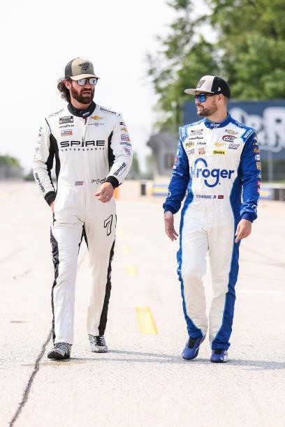 Corey LaJoie, driver of the Diamond Creek Water Chevrolet, and Ricky Stenhouse Jr., driver of the Kroger/BallPark Buns & Rolls Chevrolet, walks the...