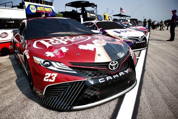 The Dr. Pepper Toyota, driven by Bubba Wallace and the FedEx Freight Toyota, driven by Denny Hamlin sit in the garage area during qualifying for the...