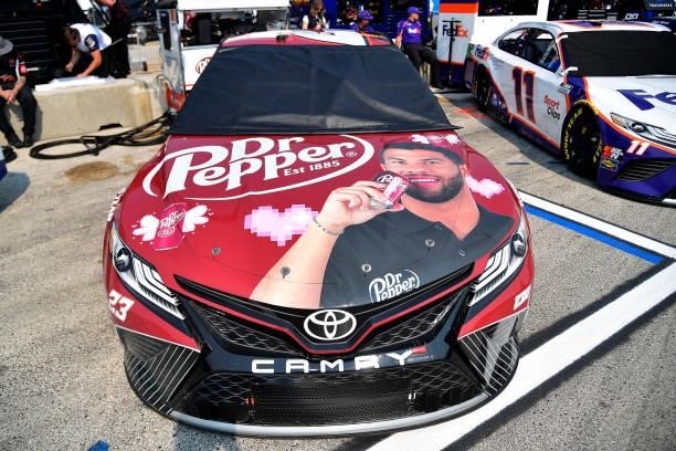 The Dr. Pepper Toyota, driven by Bubba Wallace sits in the garage area during qualifying for the NASCAR Cup Series Jockey Made in America 250...