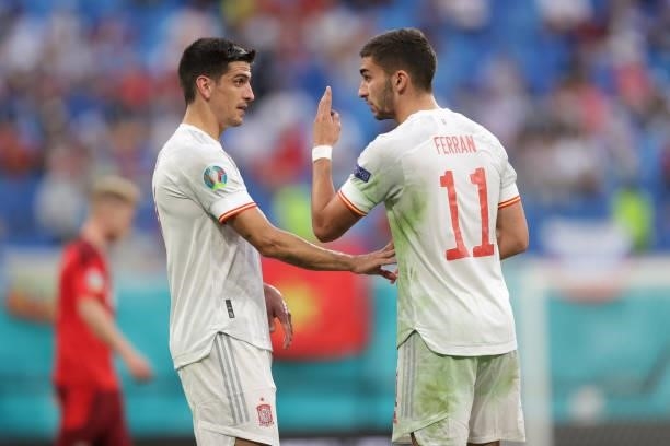 Ferran Torres of Spain speaks with his teammate Gerard Moreno during the UEFA Euro 2020 Championship Quarter-final match between Switzerland and...