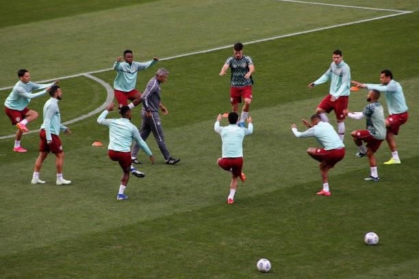 Fluminense team players warms-up before start a match between Flamengo and Fluminense as part of Brasileirao 2021 at Neo Quimica Arena on July 04,...