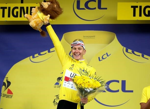 Tadej Pogacar of Slovenia and UAE Team Emirates retains the yellow jersey of race's leader during the podium ceremony of stage 9 of the 108th Tour de...