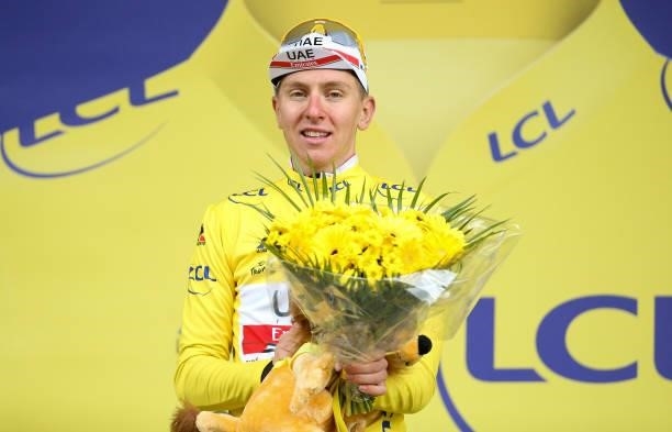 Tadej Pogacar of Slovenia and UAE Team Emirates retains the yellow jersey of race's leader during the podium ceremony of stage 9 of the 108th Tour de...