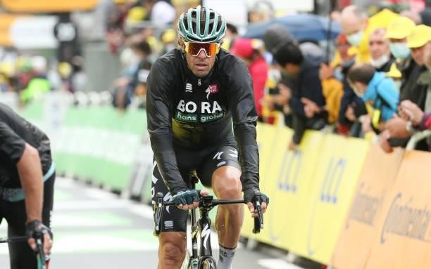 Daniel Oss of Italy and Bora - Hansgrohe crosses the finish line during stage 8 of the 108th Tour de France 2021, a stage of 151 km between Oyonnax...