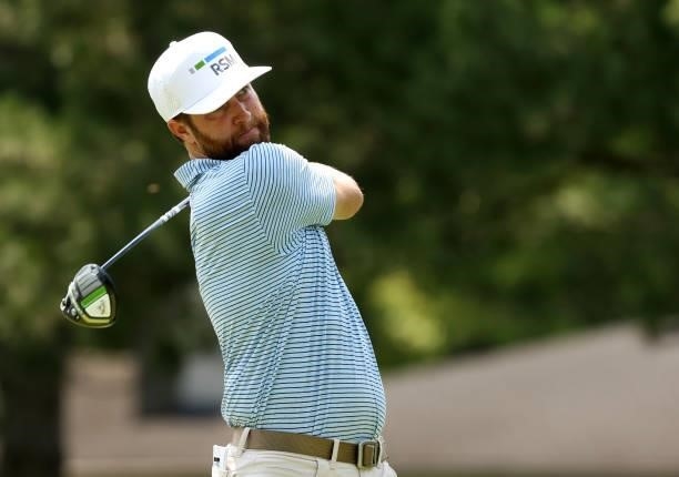 Chris Kirk plays his shot from the fourth tee during the final round of the Rocket Mortgage Classic on July 04, 2021 at the Detroit Golf Club in...