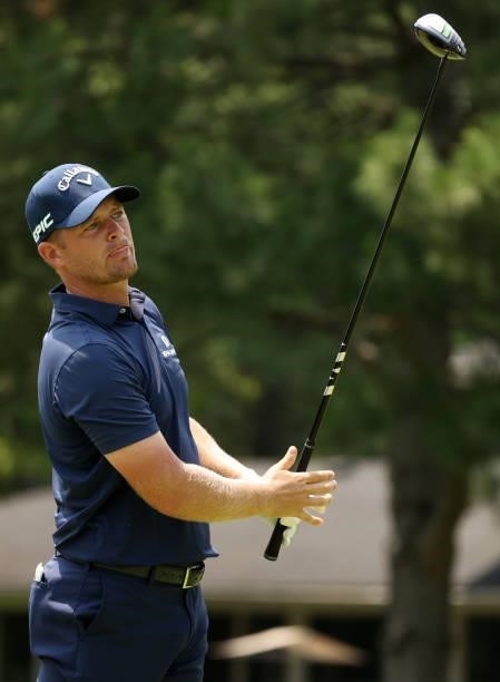 Tom Lewis of England plays his shot from the fourth tee during the final round of the Rocket Mortgage Classic on July 04, 2021 at the Detroit Golf...