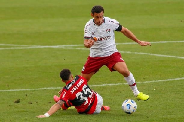 Fred of Fluminense fights for the ball against Joao Gomes of Flamengo during a match between Flamengo and Fluminense as part of Brasileirao 2021 at...