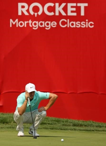 Alex Noren of Sweden prepares to putt for birdie putt on the 18th green during the final round of the Rocket Mortgage Classic on July 04, 2021 at the...