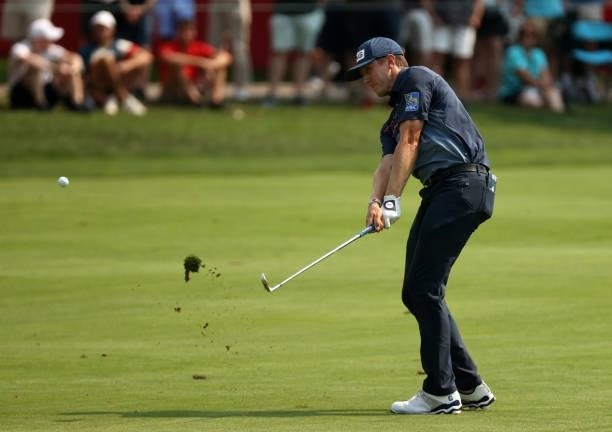 MacKenzie Hughes of Canada plays his shot on the 18th hole during the final round of the Rocket Mortgage Classic on July 04, 2021 at the Detroit Golf...