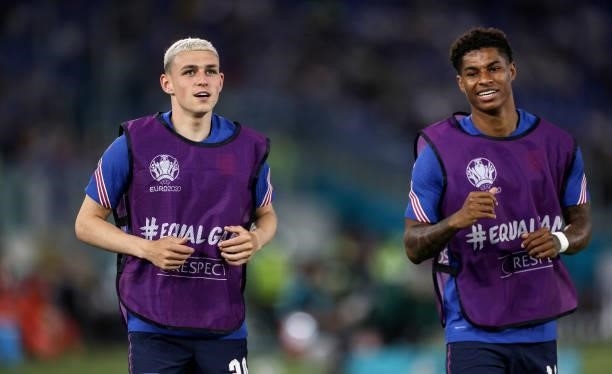 Phil Foden and Marcus Rashford of England warm up prior to the UEFA Euro 2020 Championship Quarter-final match between Ukraine and England at...